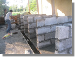 Construction progresses - kennel floors concreted, drainage channels installed and dividing walls of kennels built