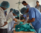 Clinical staff hard at work with two operating tables in use