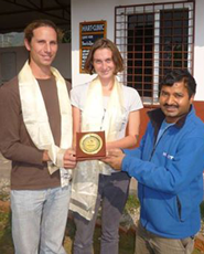 HART's resident vet, Dr Surendra Prasad Kanu, presenting a token of appreciation to Hugh & Holly Simon