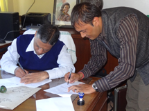 IAAS Dean, Professor Narendra Chaudhary, and HART Director Khageshwaar Sharma sign the MOU