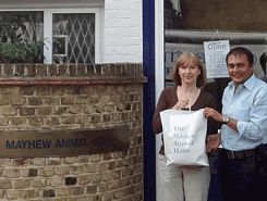 Khageshwaar receiving donated materials from Caroline Yates, CEO of the Mayhew Animal Home