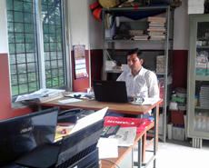 Narayan Dhakal settling in to the new office