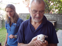 Dr Russell Lyon and Dr Frances Coles treat the white puppy