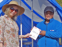 Barbara Webb presenting Chandra Rai, HART's Community Liaison Officer, with a copy of 'Rabid' on behalf of Olivia Stuart