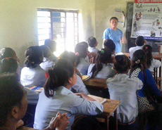 Chandra Rai giving a talk on bite avoidance and the safe handling of dogs to a class of Sauraha schoolchildren